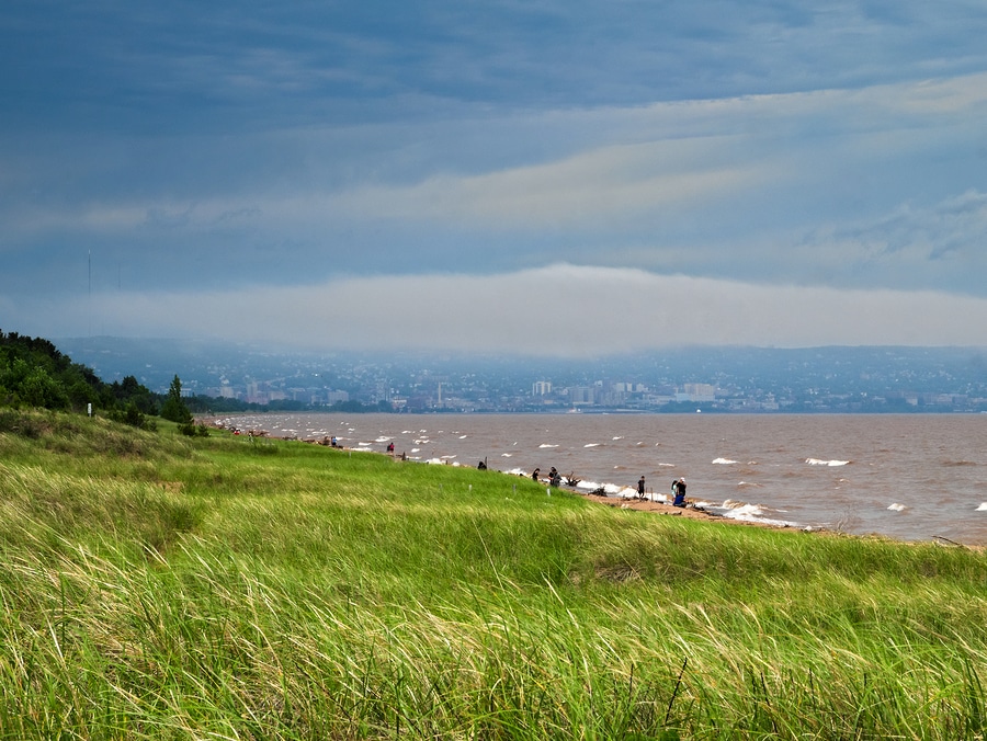 Summer at Park Point Beach On Lake Superior With Duluth, Minnesota In Back