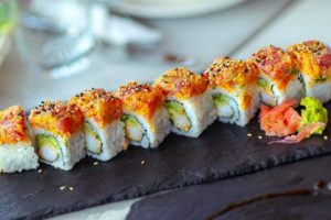 Closeup photo of a sushi roll, traditional tasty Japanese food,